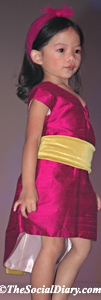 child model in vibrant pink dress